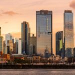 City skyline with modern skyscrapers at sunset